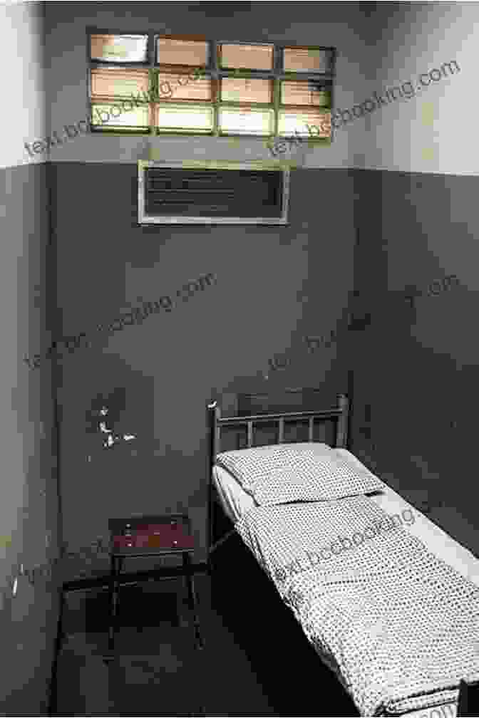 A Photo Of A Prison Cell, With Bars And A Solitary Bed. In The Shadow Of The Volcano: One Ex Intelligence Official S Journey Through Slums Prisons And Leper Colonies To The Heart Of Latin America