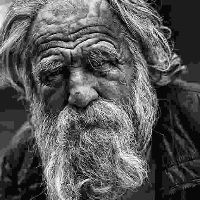 An Elderly Man With A Weathered Face And Kind Eyes Sits On A Park Bench, Lost In Thought. Old Man Par Ric K Hill