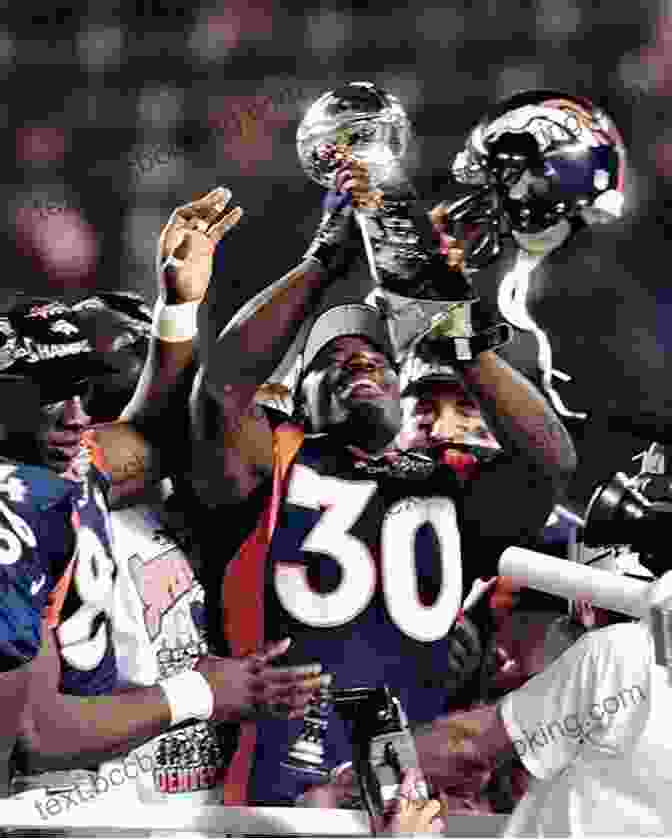 Terrell Davis Holding The Super Bowl MVP Trophy On The Field With Terrell Davis (Athlete Biographies)