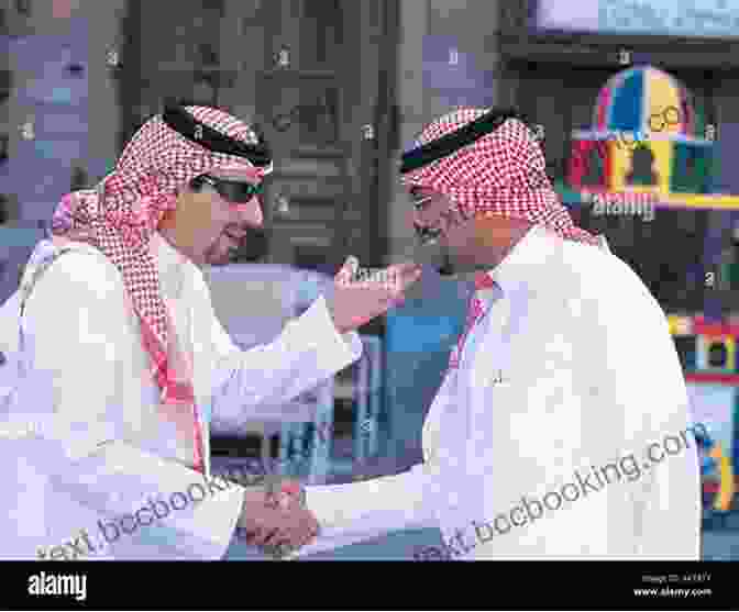 Two Men In Traditional Saudi Arabian Attire Exchanging A Warm Greeting Working And Living In Saudi Arabia: Second Edition